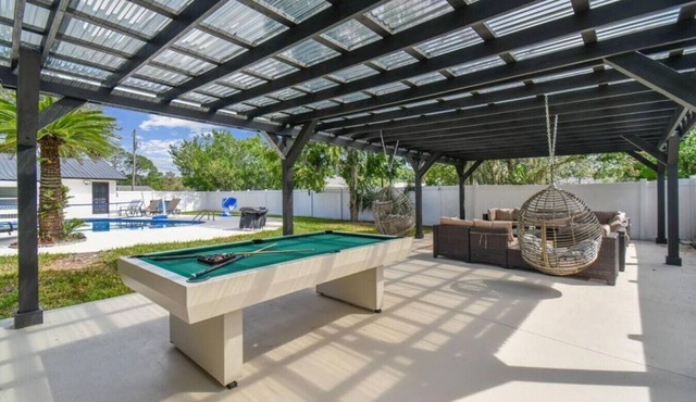 Resort Style 5bedrooms/2bathrooms home with pool, Games and a pool table.