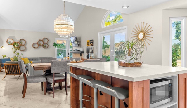 Resort-style home with pool, slide, fire pit & outdoor kitchen. Ideal for family mid-term stays.