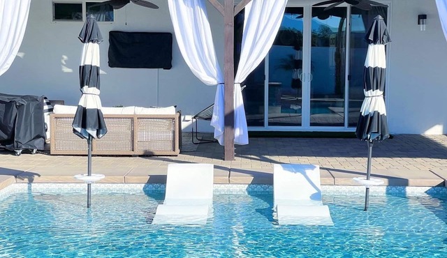 Resort style home with saltwater pool, hot tub, games, and a spacious backyard