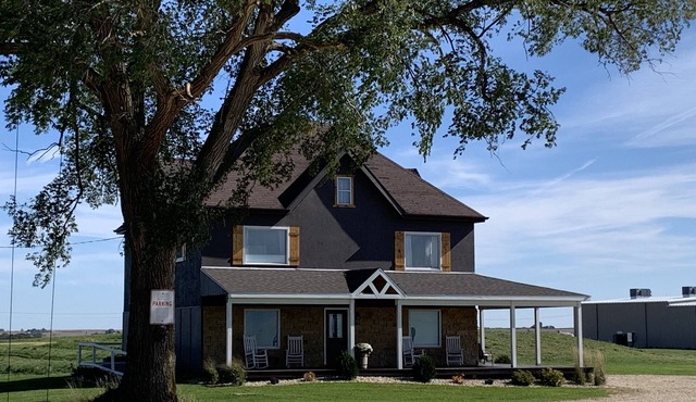 Restored farmhouse sits atop 54 acres with 360 degree views of picturesque WI.