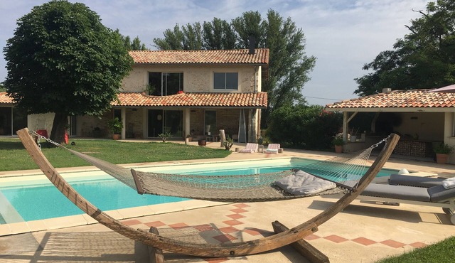 Restored former sheepfold with dovecote, swimming pool and lake view.