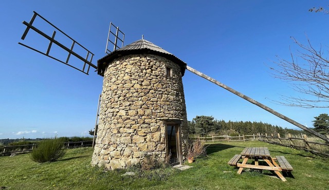 Restored windmill with countryside view