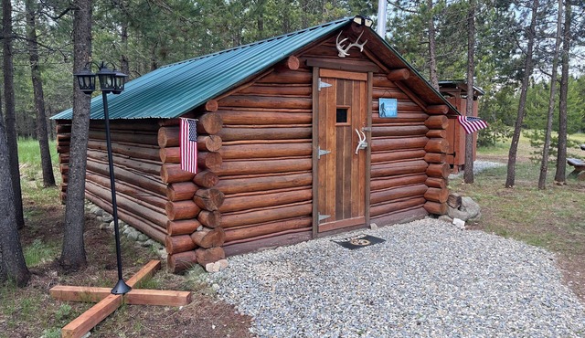Retreat to our cozy cabin nestled in a private hideaway.nSolar lights & shower