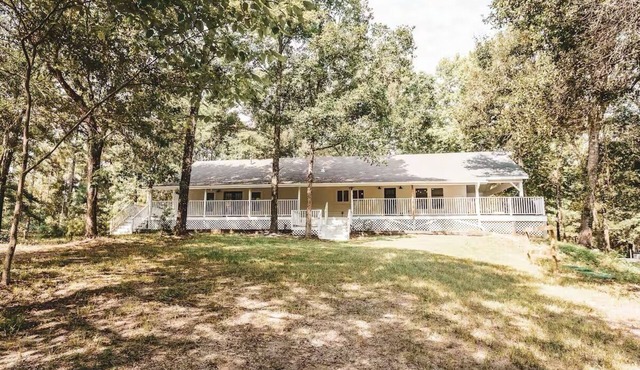 Retreat to the country. Three updated farmhouses, 28 acres, pickleball court.