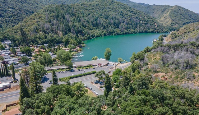 Retro RV with picturesque hills and lake access