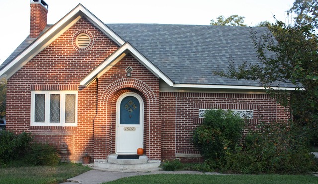 Right in the middle of town, charming 1930's brick home.