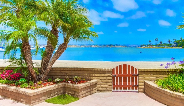 Right On The Beach! Exquisitely Remodeled 2BR/2BA . Perfect For Families.