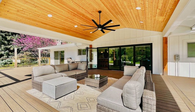 River and mountain view home with expansive deck, private pool