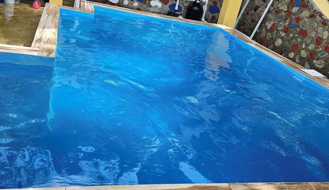 River and swimming pool cabin