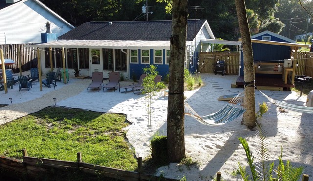 River Beach Retreat: with Tiki Bar, Fire Pit, Hot Tub & Clear Kayak