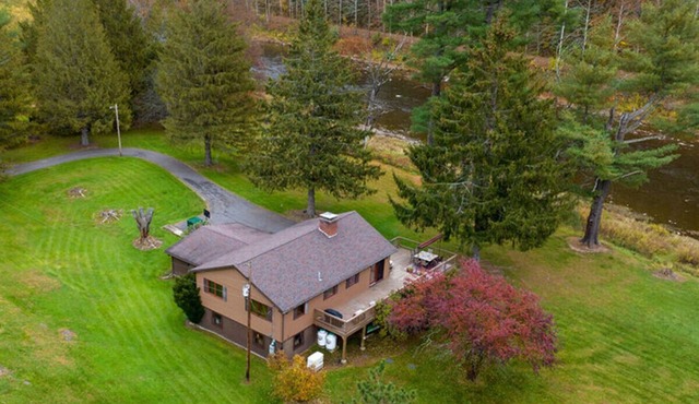 River front paradise with in-home fireplace.