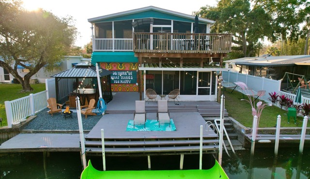River home with huge arcade, hot tub, kayaks, mini golf course, 80in TV