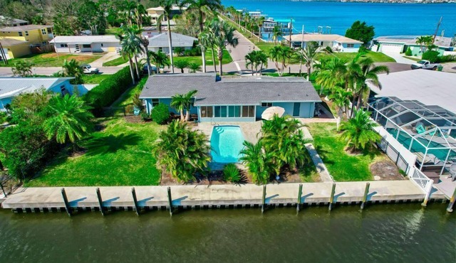River House Retreat — Canal Views and Poolside Bliss!