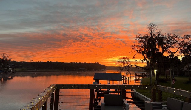 River House w/2-story dock, boat ramp, fire pits outdoor lounge area.