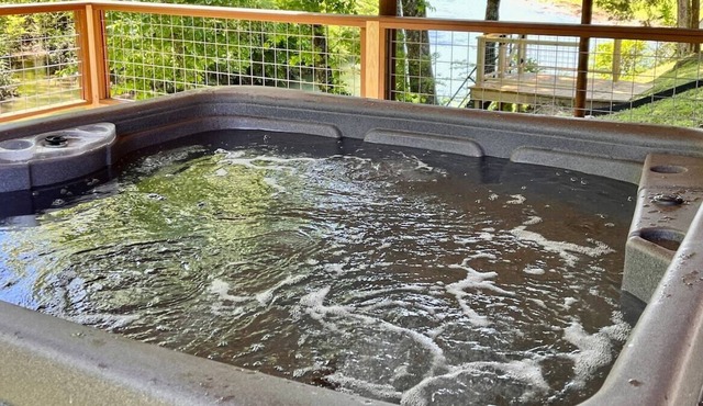 Riverfront Cabin - private hot tub, arcade game, steps to water
