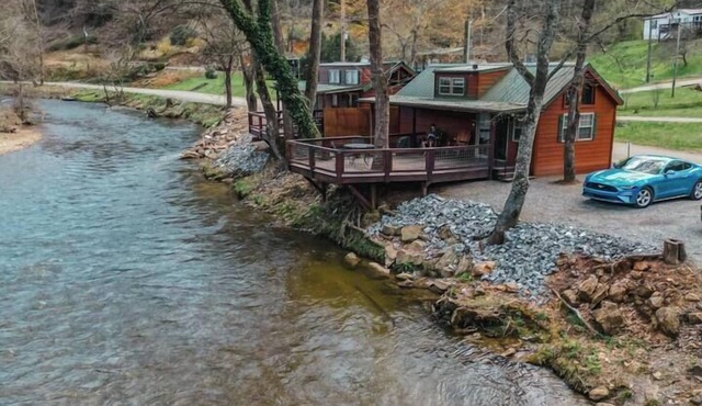Riverfront Cabin with Deck and Fire Pit Near the Smoky Mountains!