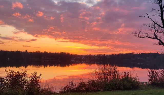 Riverfront cabin with kayaks and canoes