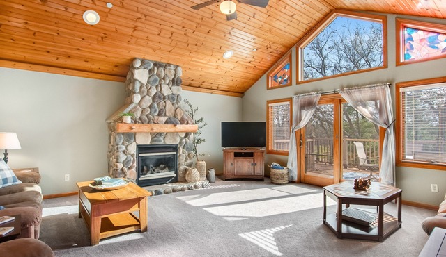 Riverfront golf resort condo with pool, hot tub, volleyball, & fairway-view deck