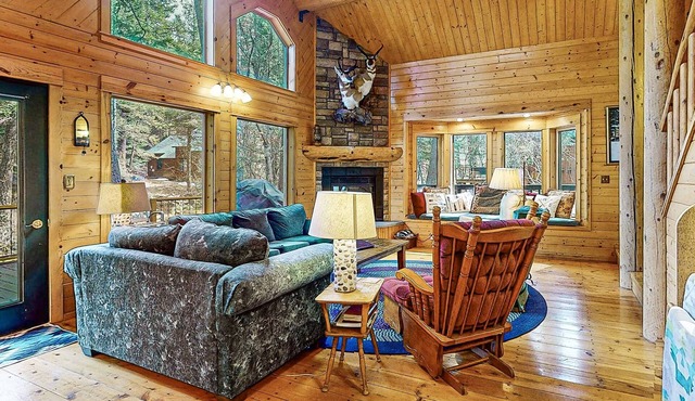 Riverfront home with deck, fireplace, & salt water hot tub- near hiking & lake
