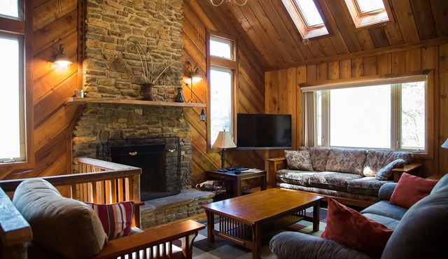 Riverfront luxury in the woods - main level master bedroom