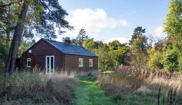 Riverside Cabin in pretty Ettrickbridge, just a short walk to village pub.