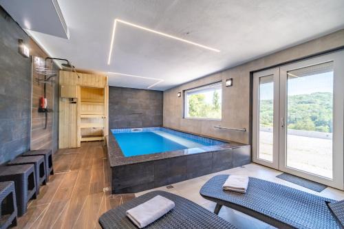Riverside house with pool jacuzzi and sauna in Croatia