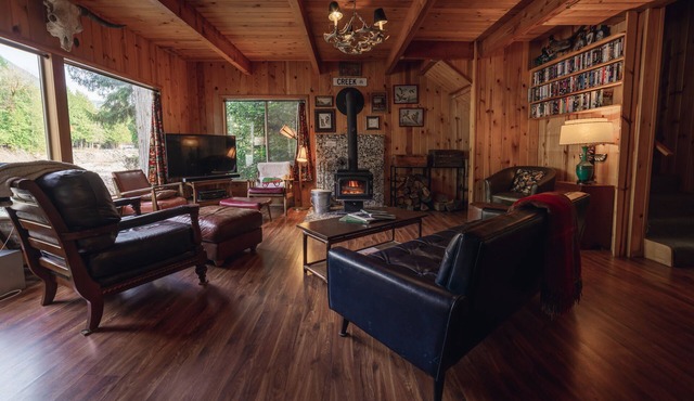 Riverside Mid-Century Cabin with Mountain Views