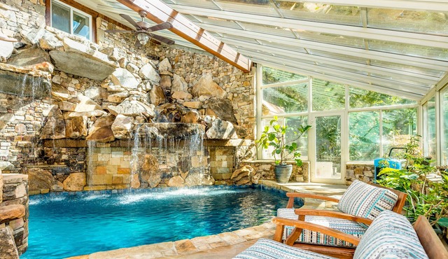 Riverside opulence with game room, private heated pool, hot tub & firepit