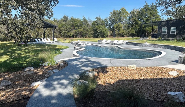 RocknRoll Ranch a resort in Brenham, TX features an 85-foot guitar-shaped pool