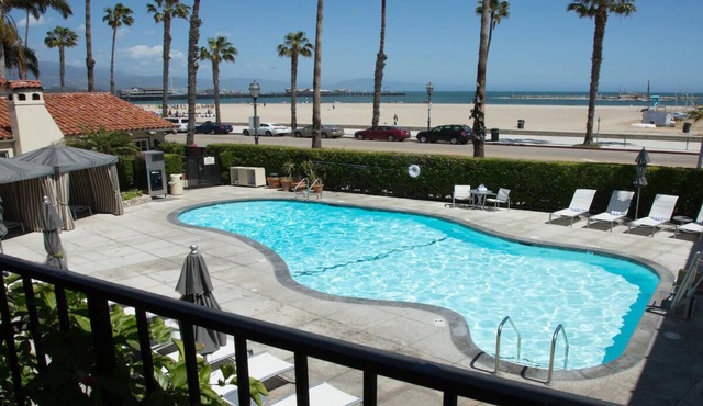 Romantic Beach Escape! Outdoor Pool, Bikes & Gym Access | Pet Friendly!