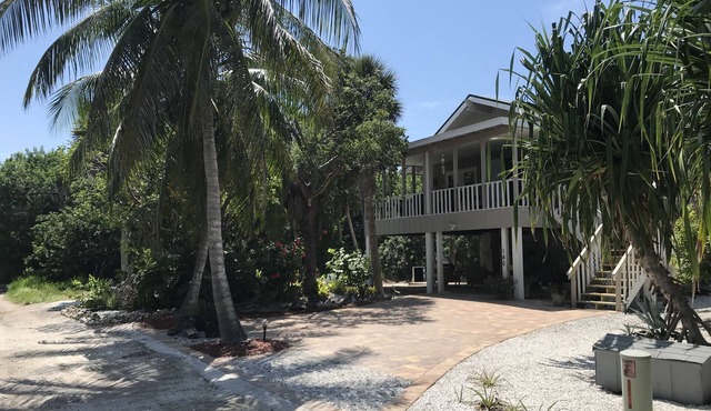 Romantic beach home with golf cart Remodeled Coastal charm