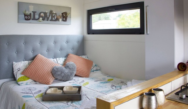 Romantic converted shipping container with outdoor bath