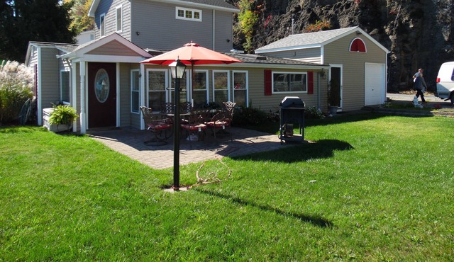 Romantic home on level Seneca Lake Front.
