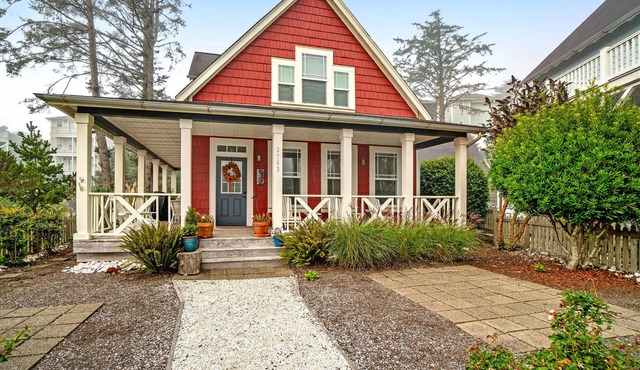 Romantic Oregon Coast Escape with Porch, Fireplace & Garden Charm