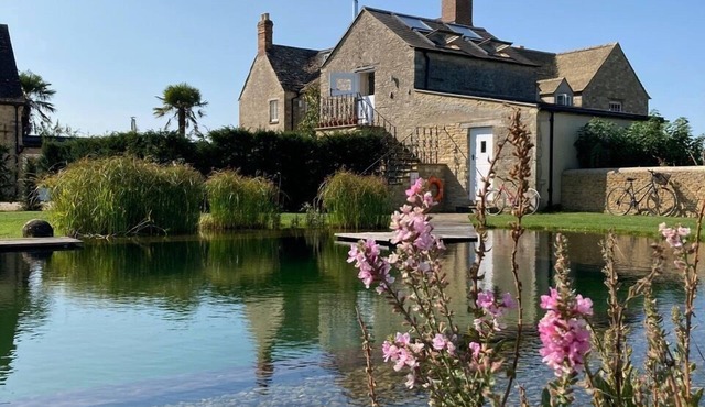 Romantic, quirky farm loft conversion with beautiful natural swimming pool