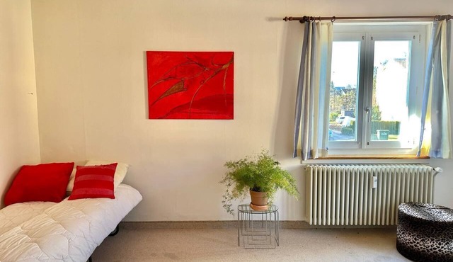 Room in a house next to bus stop