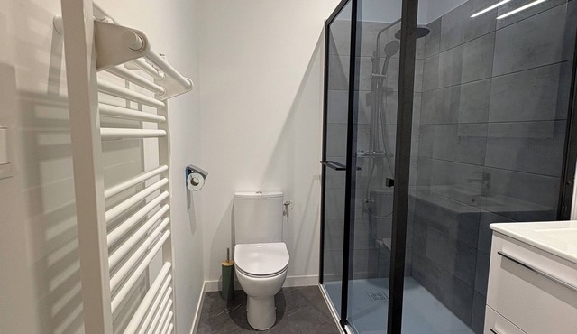 Room with bathroom and toilet in shared apartment, kitchen