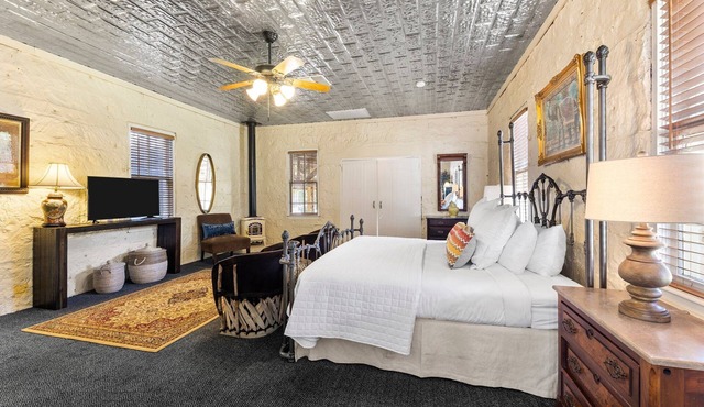 Room with One King Bed, microwave, mini-fridge, and porch