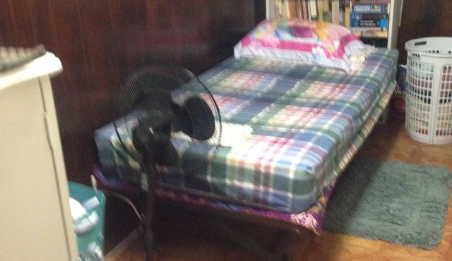 Room with TV,desktop,closet,bed,chest of drawers. Can sleep two comfortably.