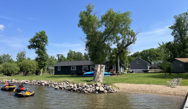 ROUND LAKE LAKE HOUSE Beautiful lake home on the water with sandy beach