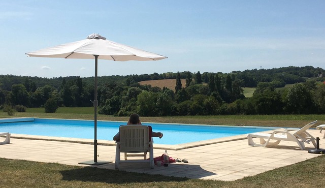 Rural converted farmhouse with heated pool and tennis court near popular village