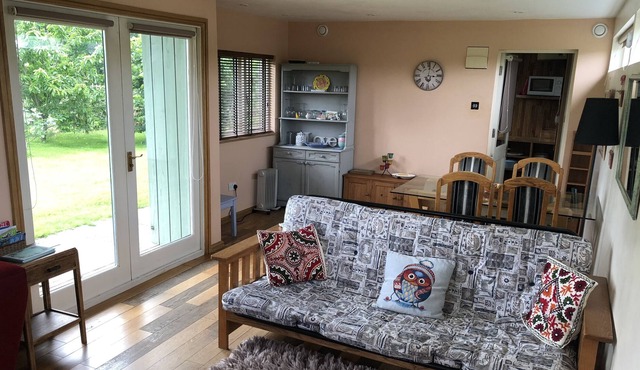 Rural self-catering lodge.South-facing sun deck, garden, views over open fields.