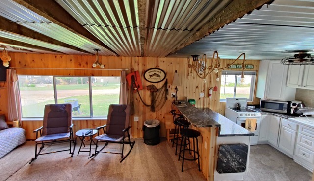 Rustic and charming two-bedroom home a block from the lake and park!