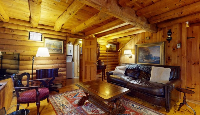 Rustic cabin in serene location with fireplace and pool access