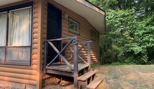 Rustic cabins in secluded campground with lake access and woods to wander in.