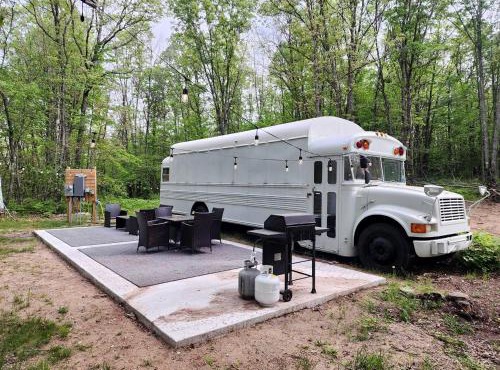 Rustic Converted School Bus with Outdoor Shower Near ORV Trails in Manistee National Forest, Michigan