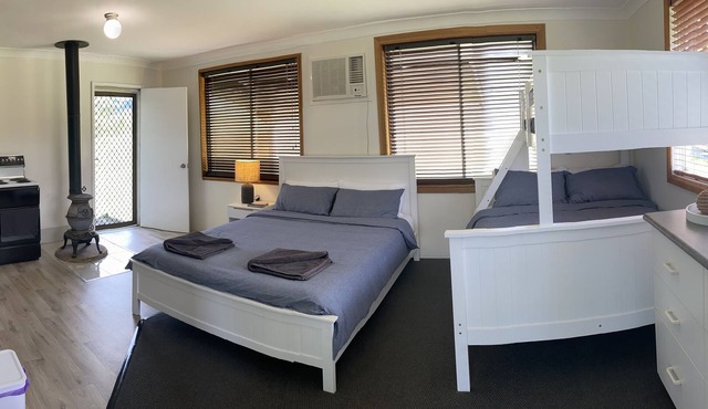 Rustic cottage close to river for swimming & fishing.