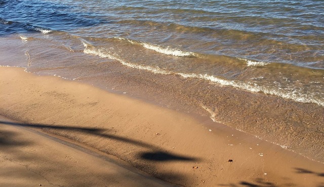 Rustic cozy cabin on a BEAUTIFUL bay of Lake Superior with prime beachfront.