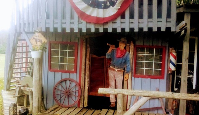 Rustic crafted Cowboy Town complete with everything needed for a weekend retreat