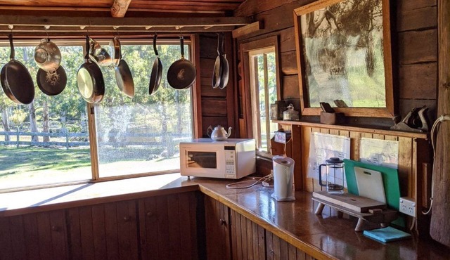 Rustic farmhouse overlooking beautiful dam with large inside and outside spaces